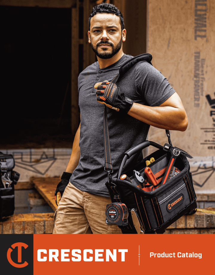 2024 Crescent Catalog cover with construction worker carrying tool bag with tools on residential construction site