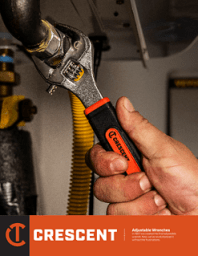 Cover of the Crescent Adjustable Wrench brochure of a man's hand using an adjustable wrench to tighten a hose